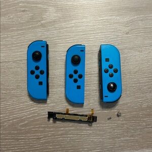 Nintendo Switch Three Blue Joy-Con Controllers + Parts  FOR PARTS ONLY